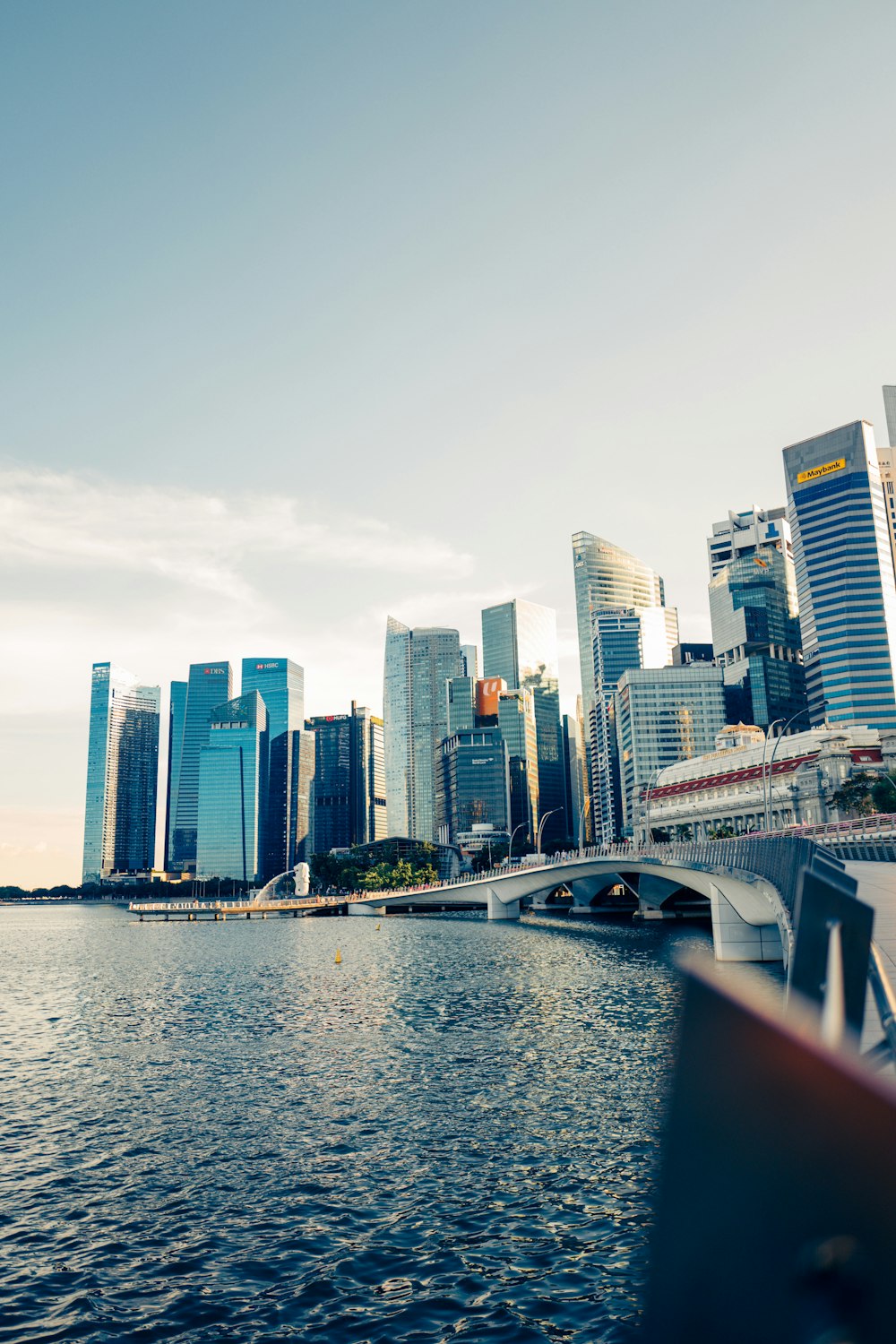 a large body of water with a city in the background