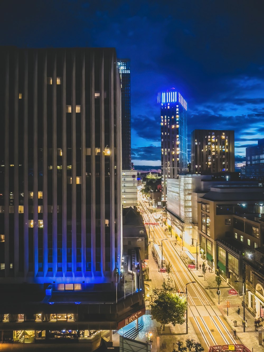 a view of a city at night from the top of a building