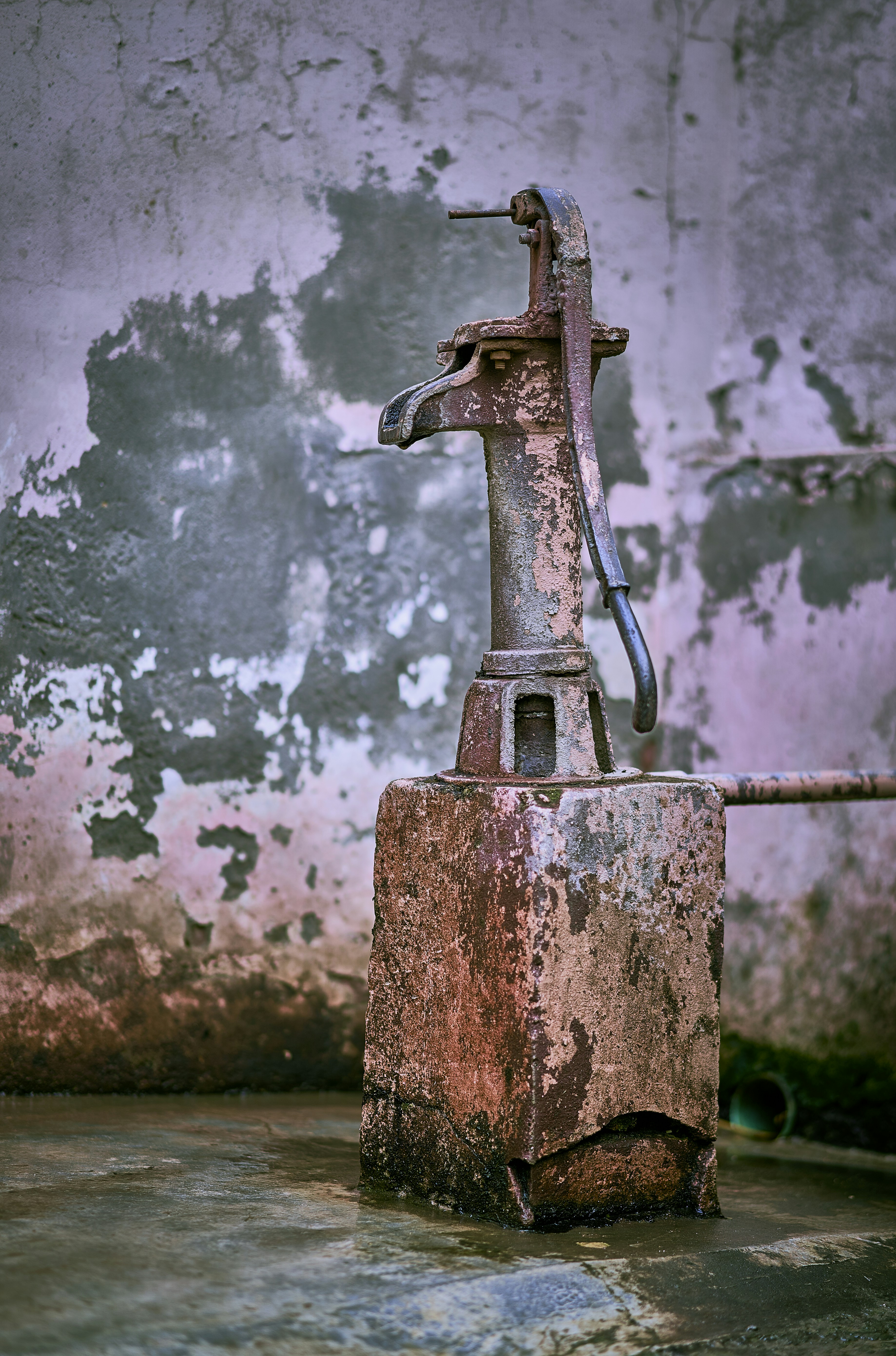 An old and rusty hand pump