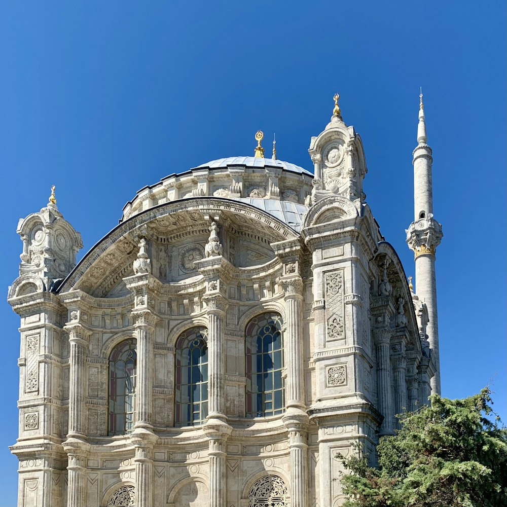 a large white building with a clock on it's side