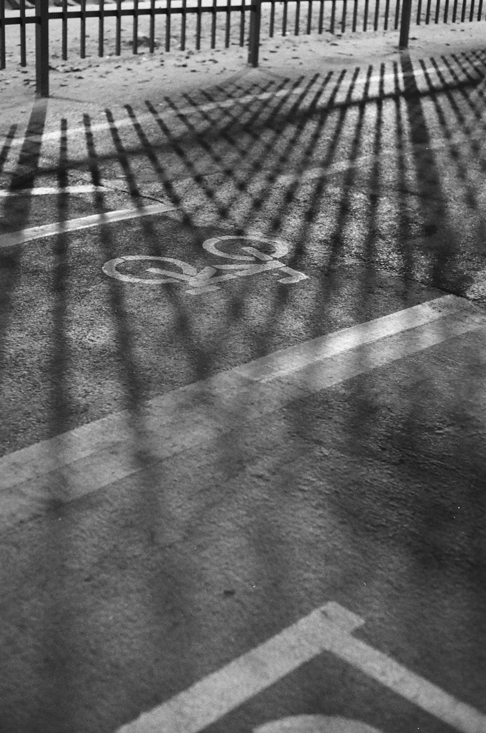 a black and white photo of a bike path