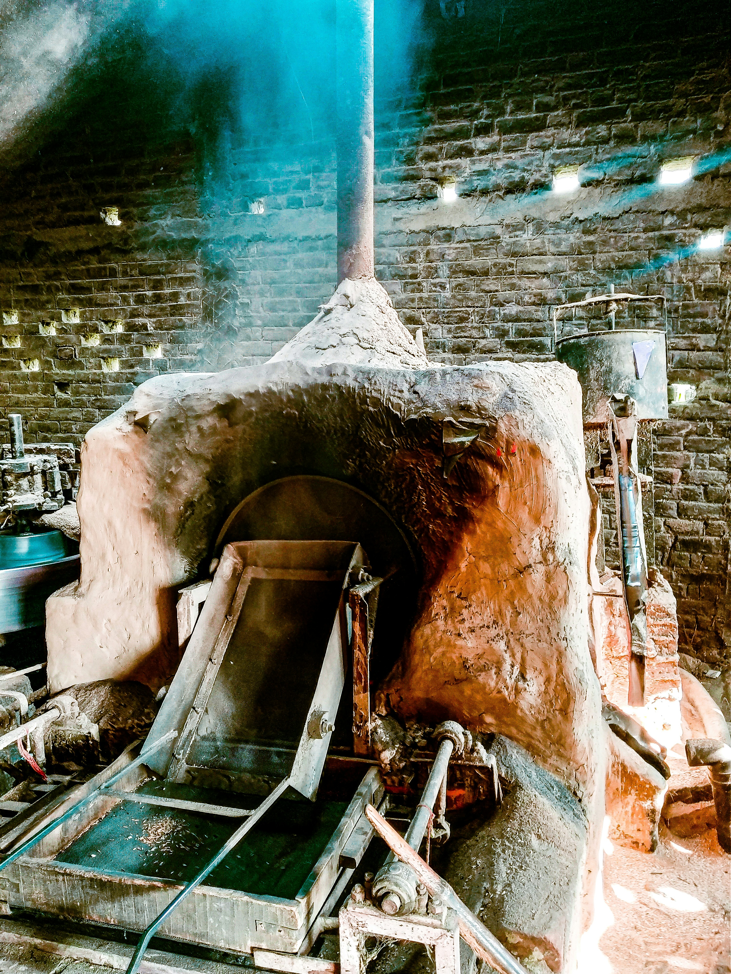 a brick oven with a lot of smoke coming out of it