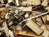 a pile of wooden chairs and chairs sitting on top of each other