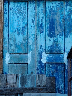 A freshly painted wooden door with smooth, even strokes visible.