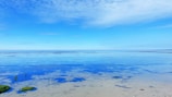 a view of the ocean from a beach