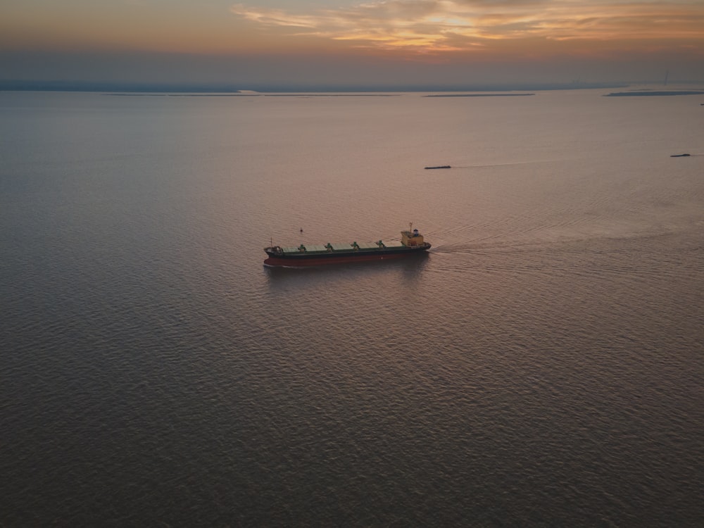 a large cargo ship in the middle of a large body of water