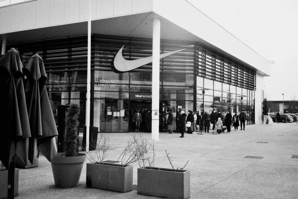 a group of people standing outside of a building