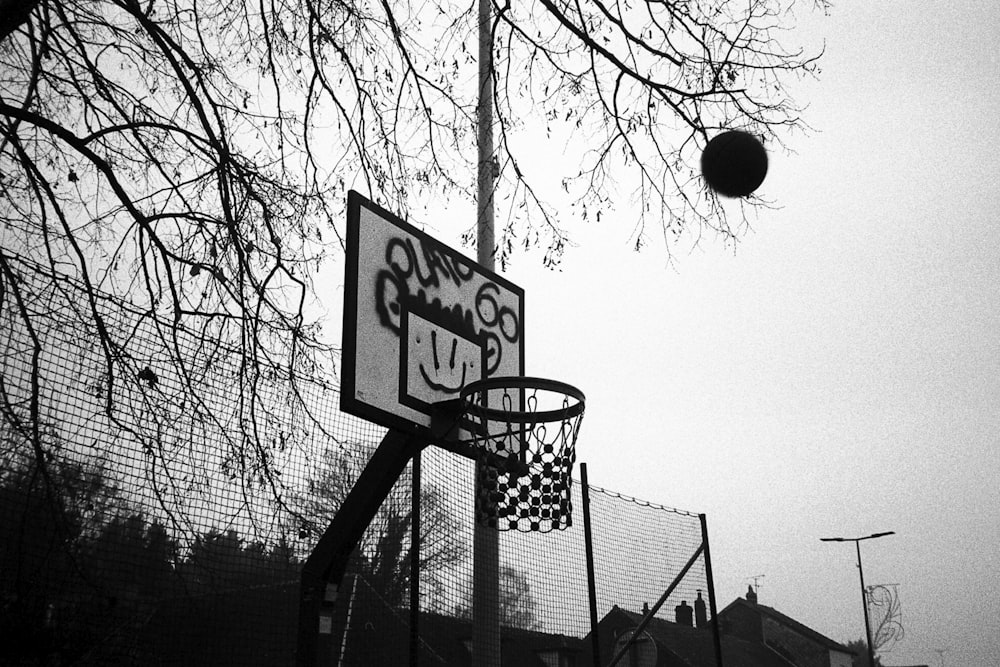 a black and white photo of a basketball hoop