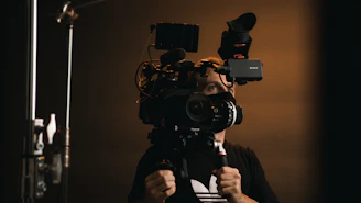 a man holding a camera up to his face