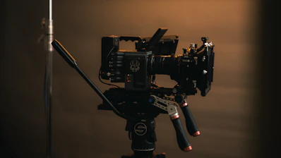a camera set up on a tripod in a dark room