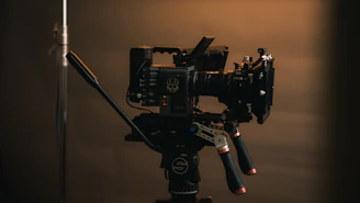 a camera set up on a tripod in a dark room