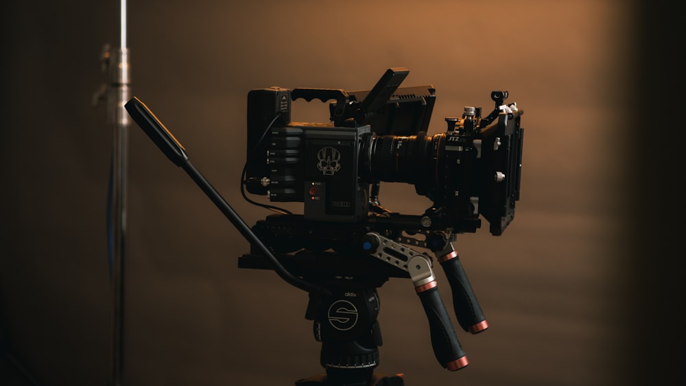 a camera set up on a tripod in a dark room