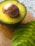 Close-up of a ripe Hass avocado sliced open showing its creamy texture.