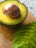 Close-up of a ripe Hass avocado sliced open showing its creamy texture.