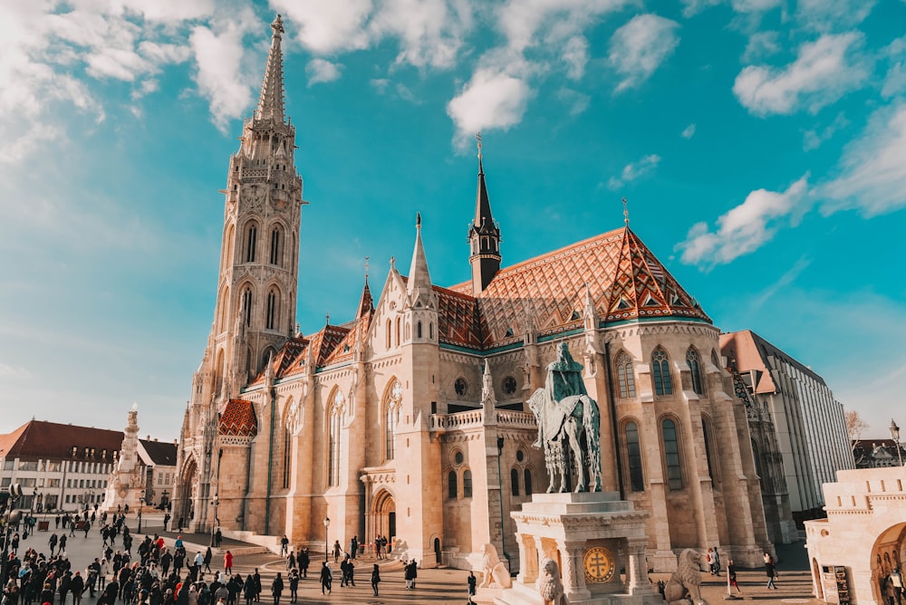 a large cathedral with a statue in front of it