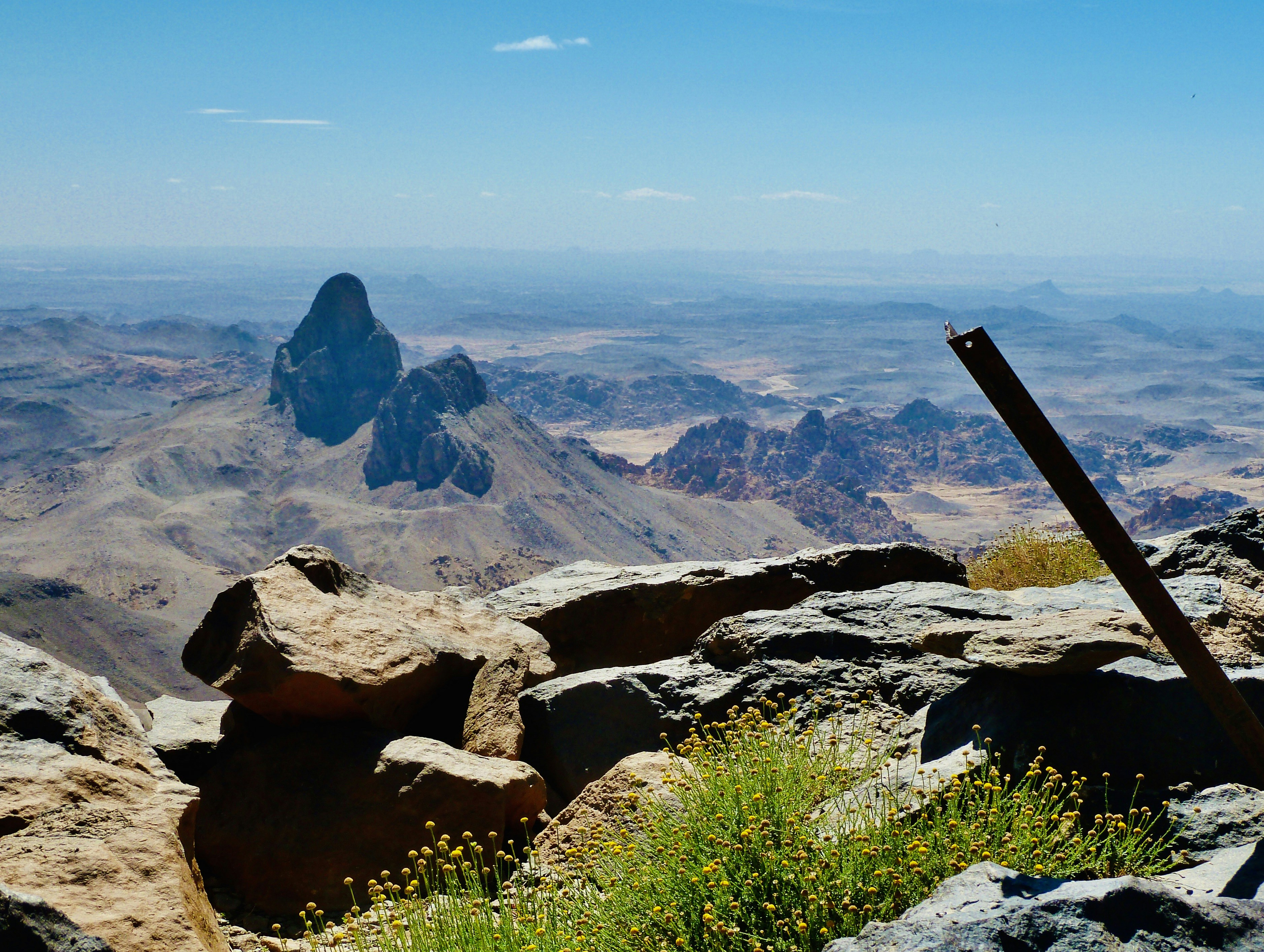 A view of a mountain range with rocks and plants