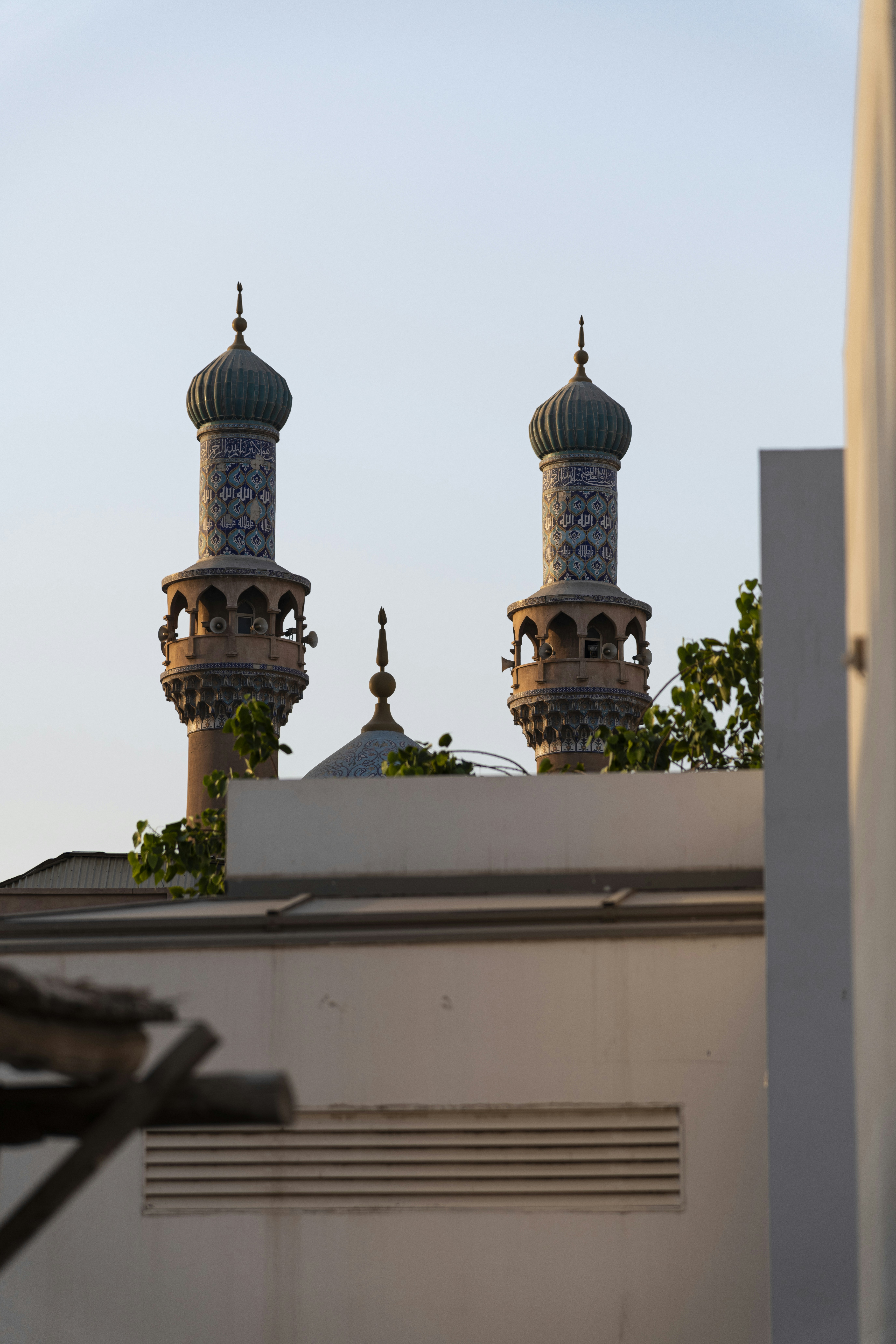 two domes on top of a building with a sky background