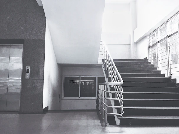 Home staircase area showing a sleek lift installed blending into the minimalistic decor.