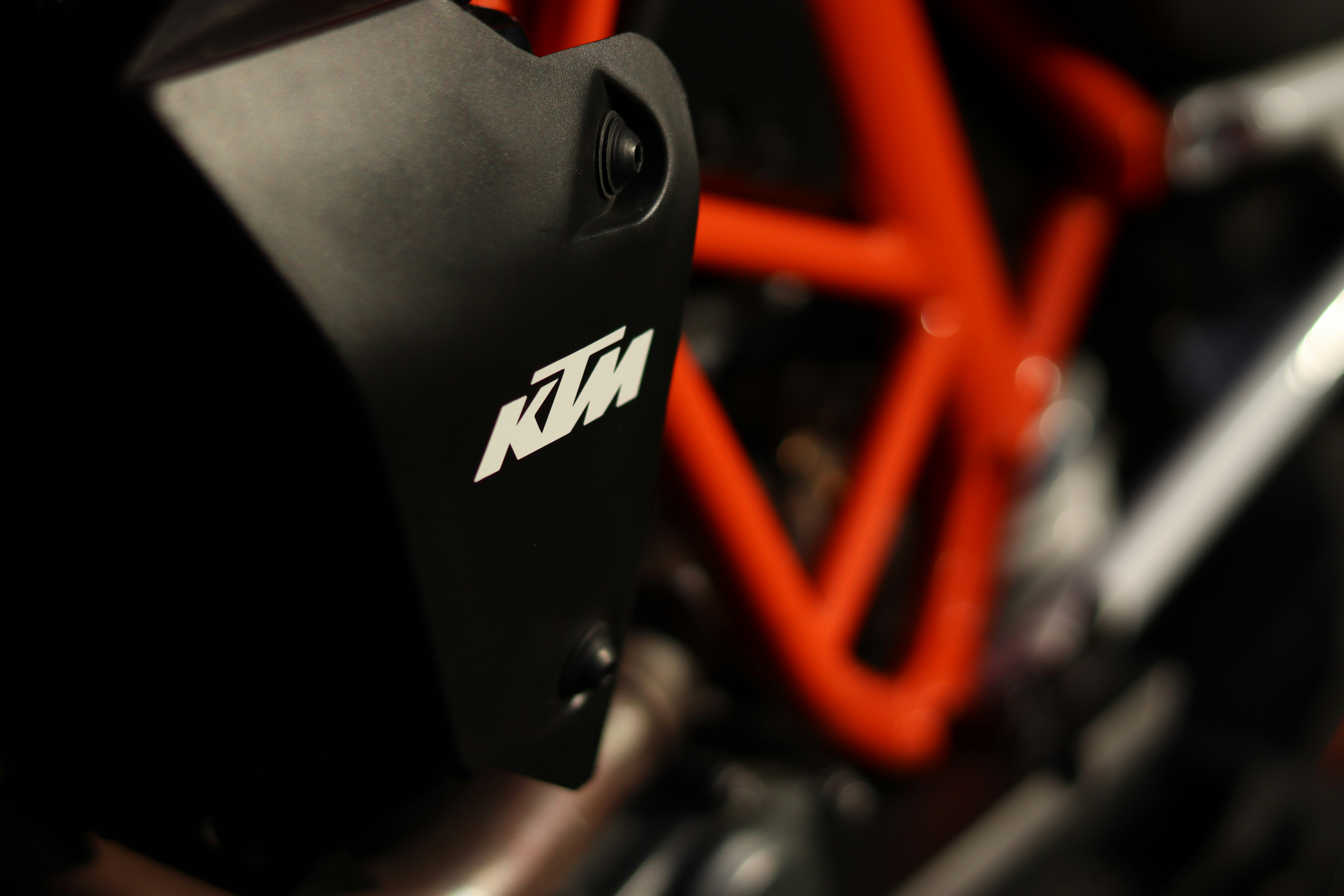 a close up of a red and black motorcycle