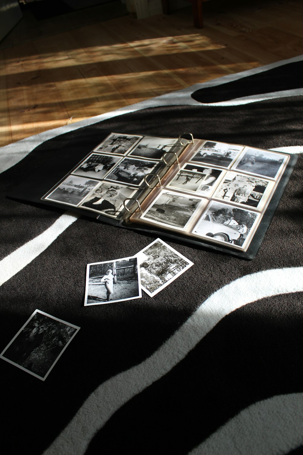 an open book laying on top of a zebra print blanket