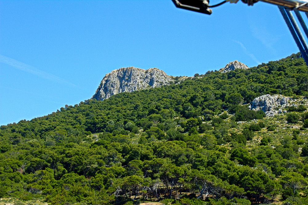 a view of a mountain from a boat on the water