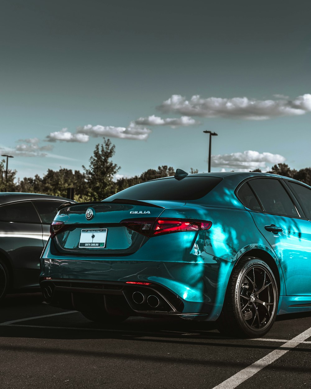 a couple of cars parked in a parking lot