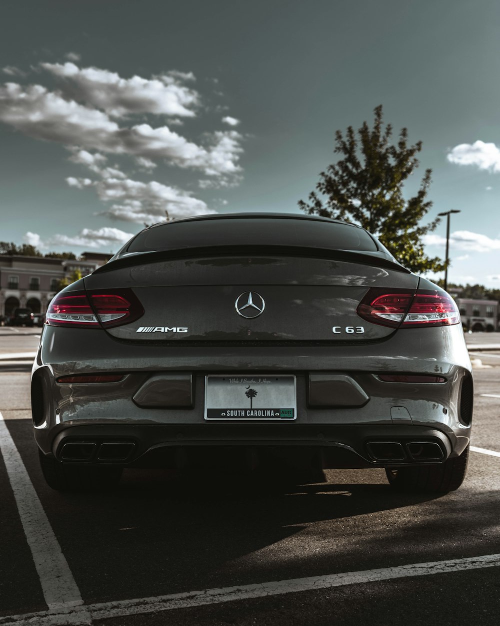 the back of a car parked in a parking lot