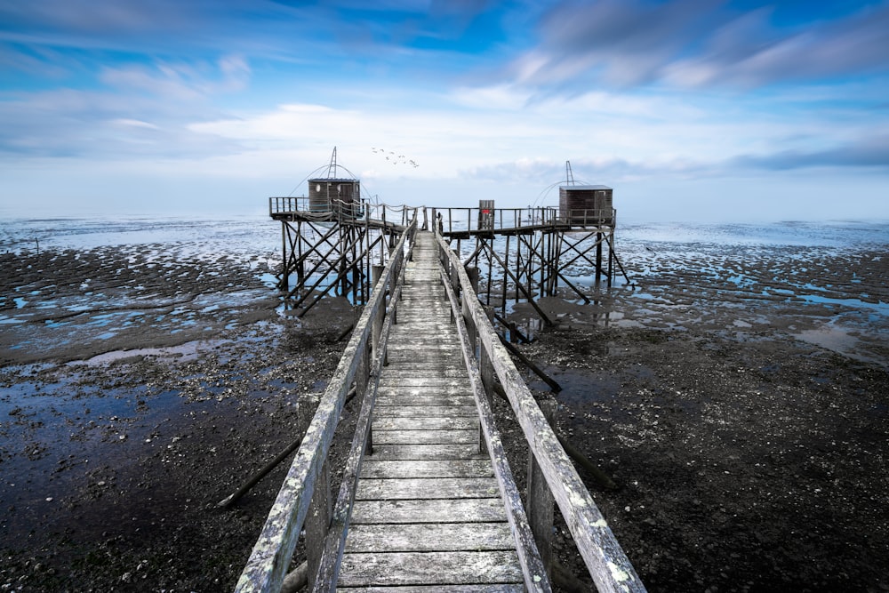 a pier with two water towers on top of it