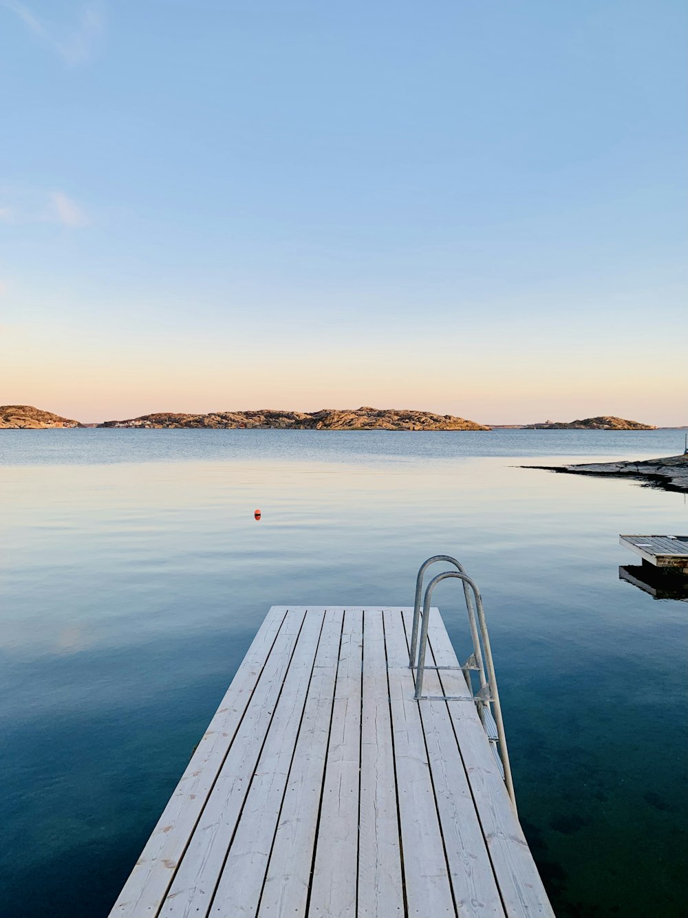 a wooden dock sitting on top of a body of water