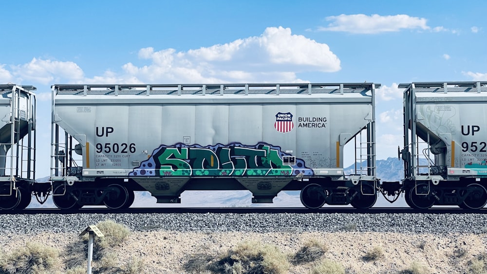 a train car with graffiti on the side of it
