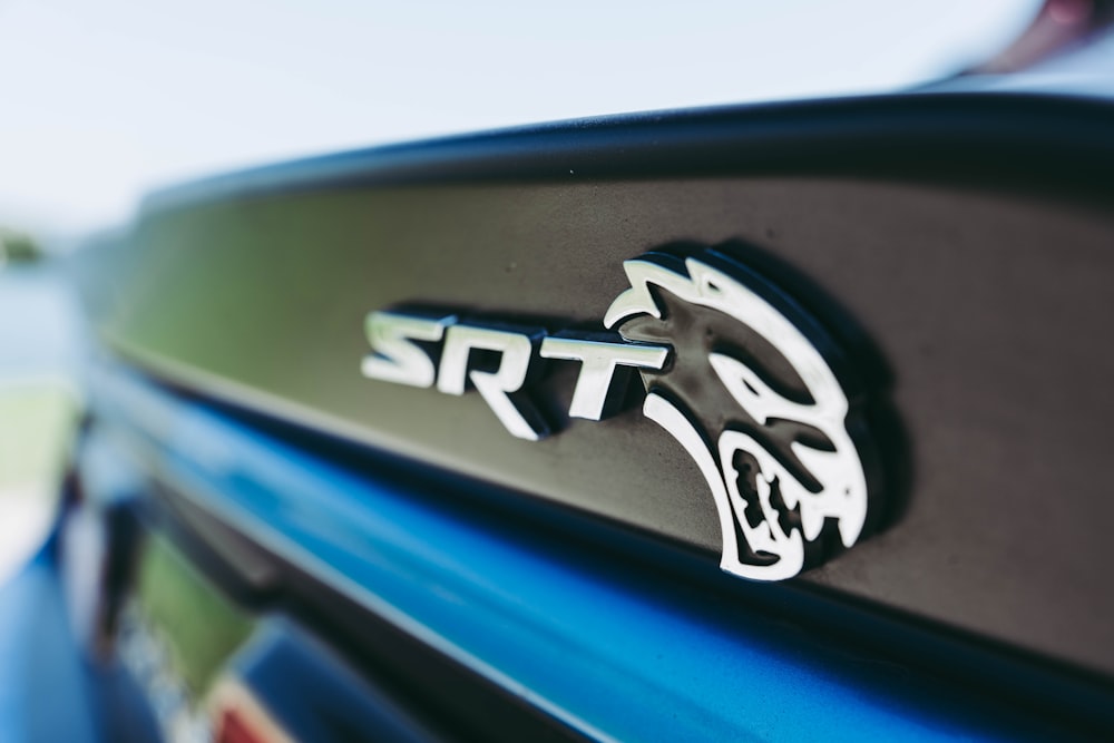 a close up of the emblem on a sports car