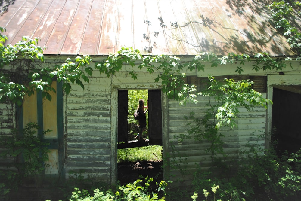 an old run down building with a broken window