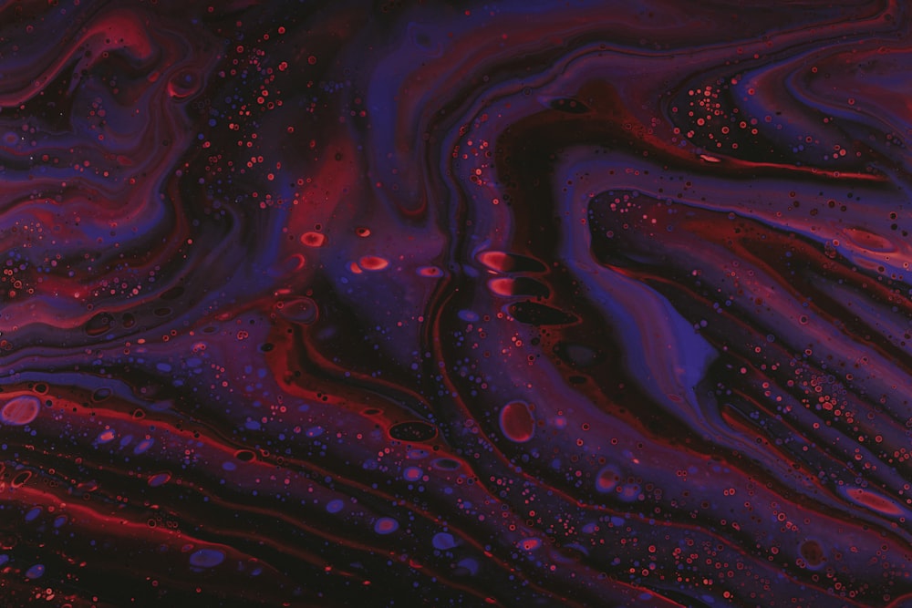 a close up of a purple and red liquid