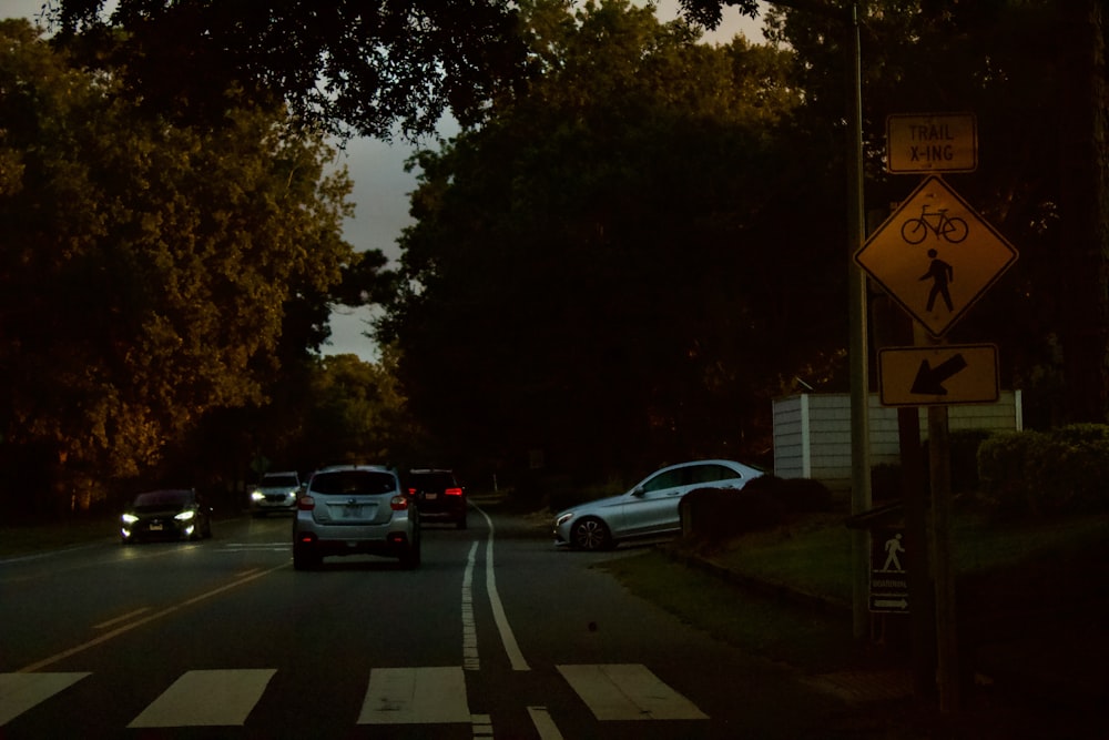 a couple of cars that are sitting in the street