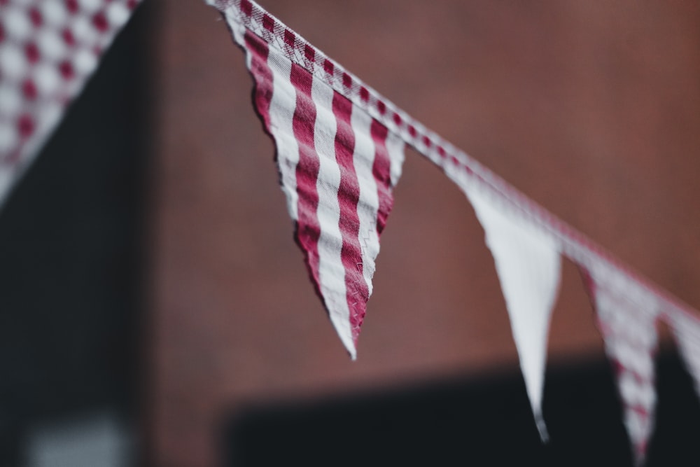 a red and white checkered flag hanging from a string