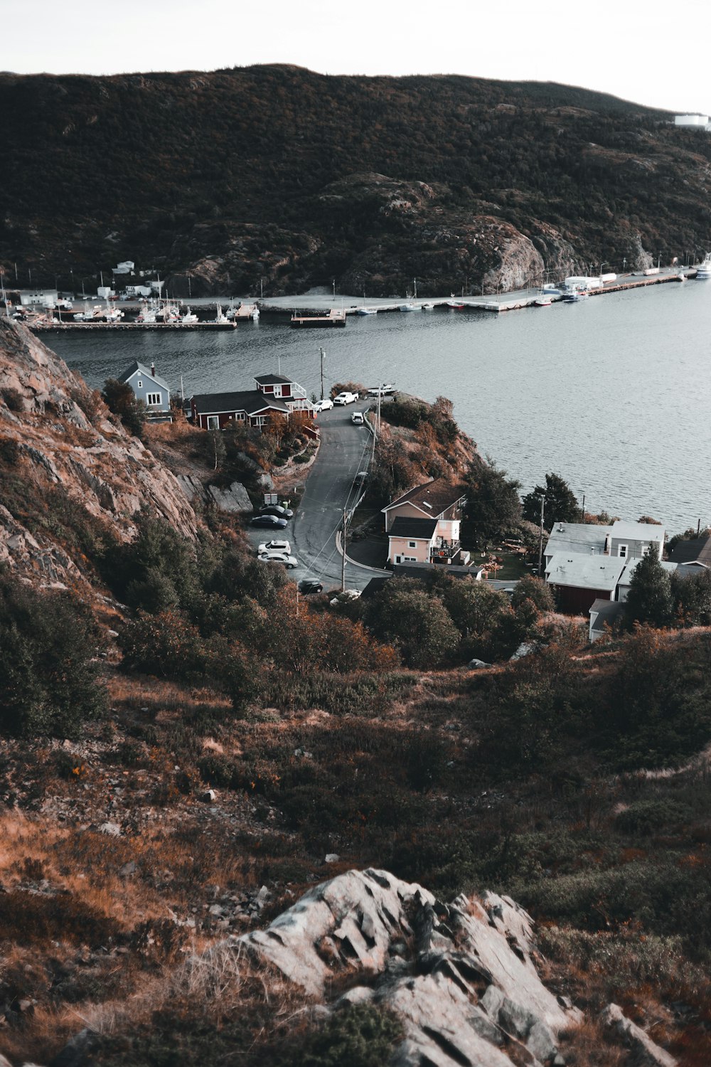 a scenic view of a small town on a hill