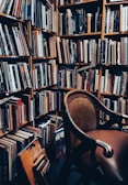 A cozy corner with comfortable seating and shelves of books.