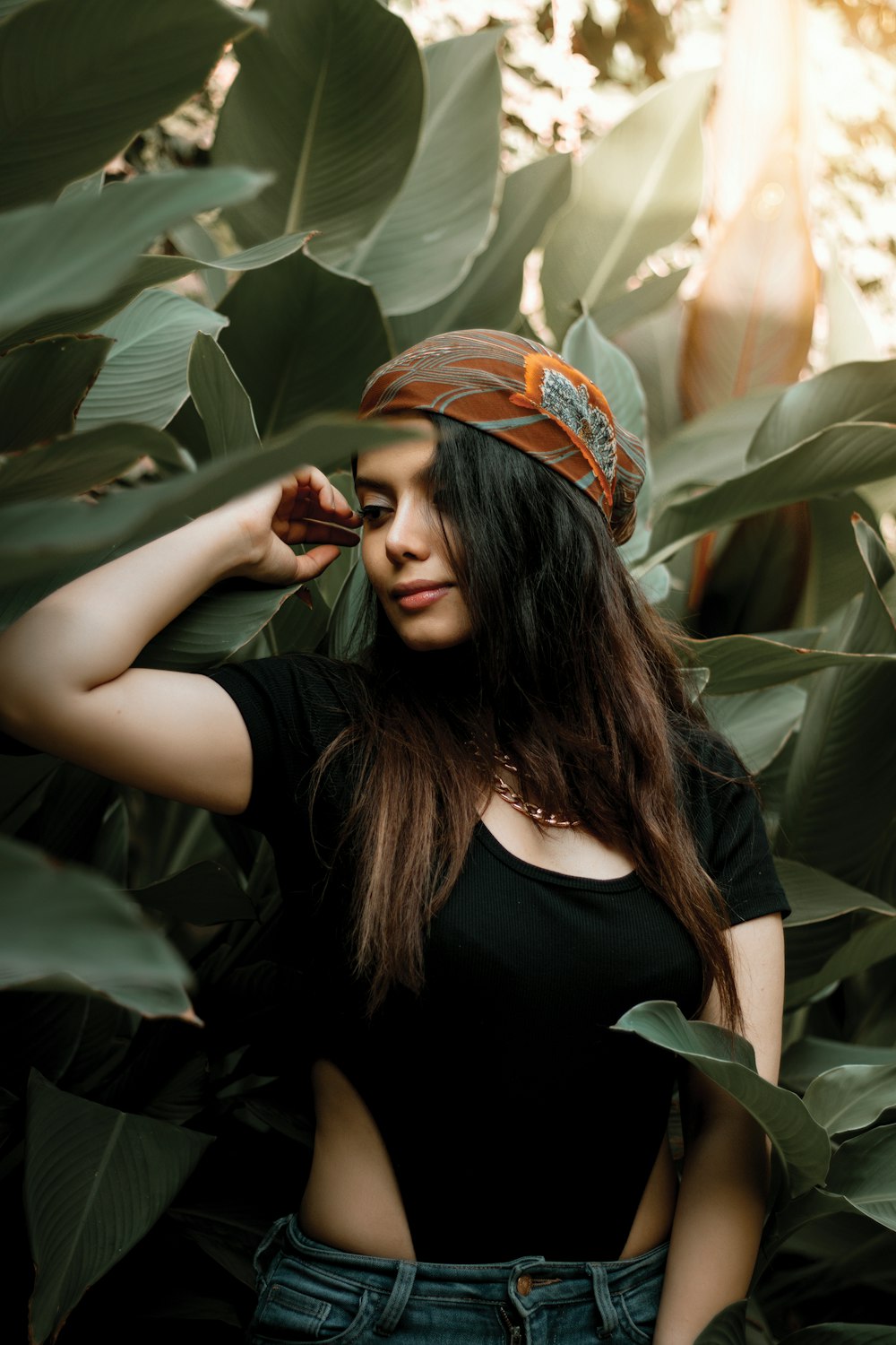 a woman standing in a field of leaves