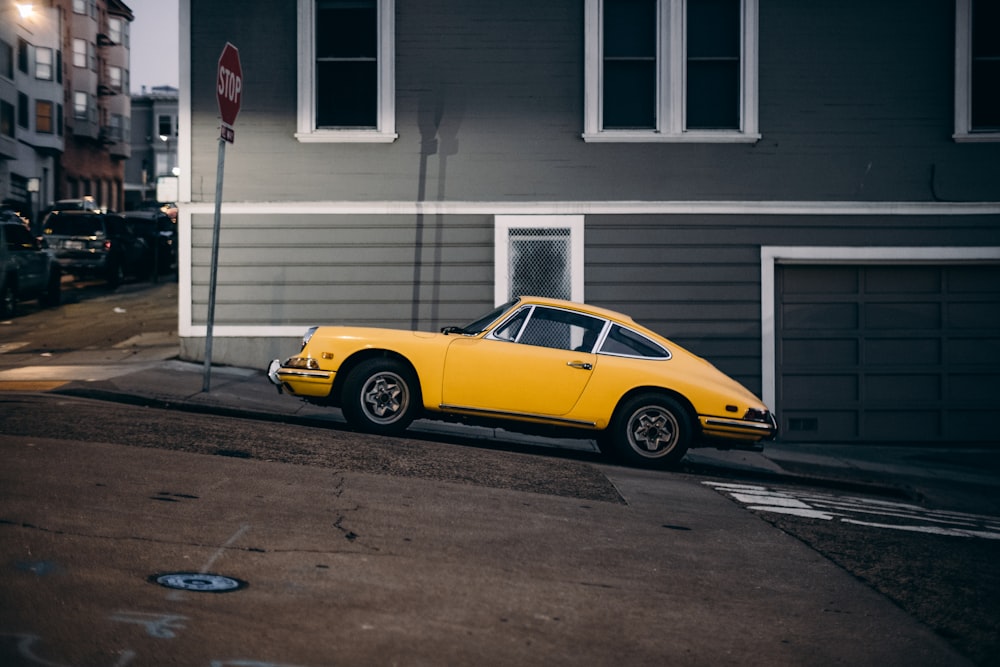 a yellow car parked on the side of the road