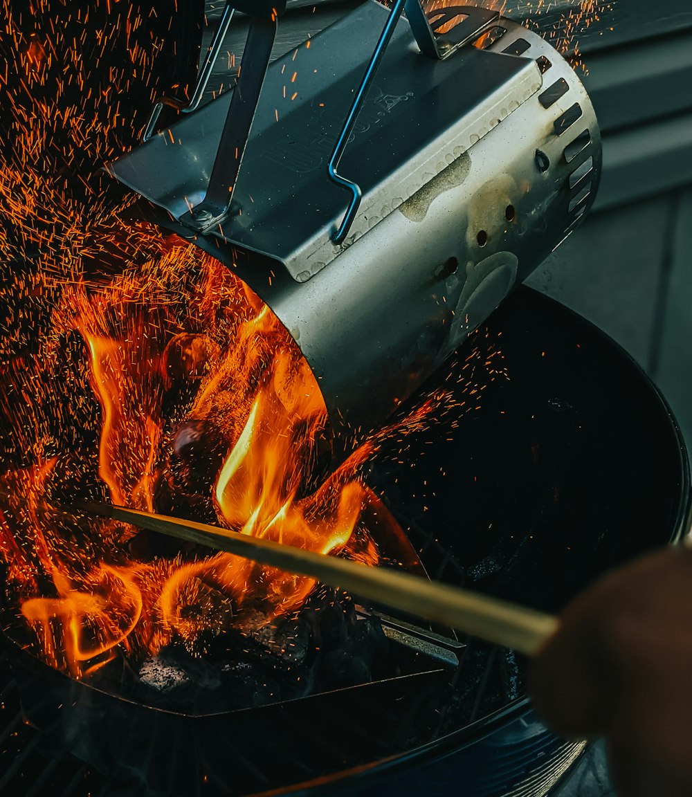 a person is cooking something on a grill