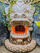 a fountain with a dragon head on top of it