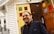 A satisfied client smiling in front of their new home after a successful purchase.