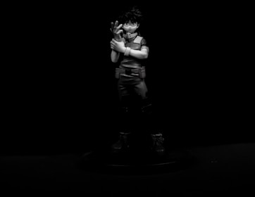 Detailed 3D printed collectible figure with sharp, modern lines on a dark background.