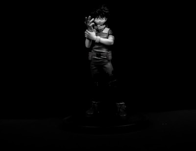 Close-up of a finely detailed custom 3D printed figurine in vibrant colors, spotlighted on a minimalist white background.