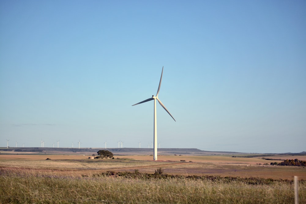 a wind turbine in the middle of a field