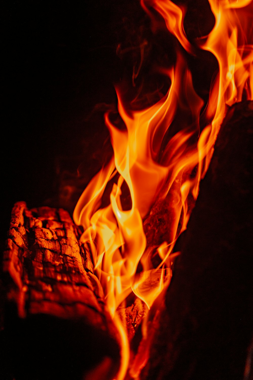 a close up of a fire in the dark