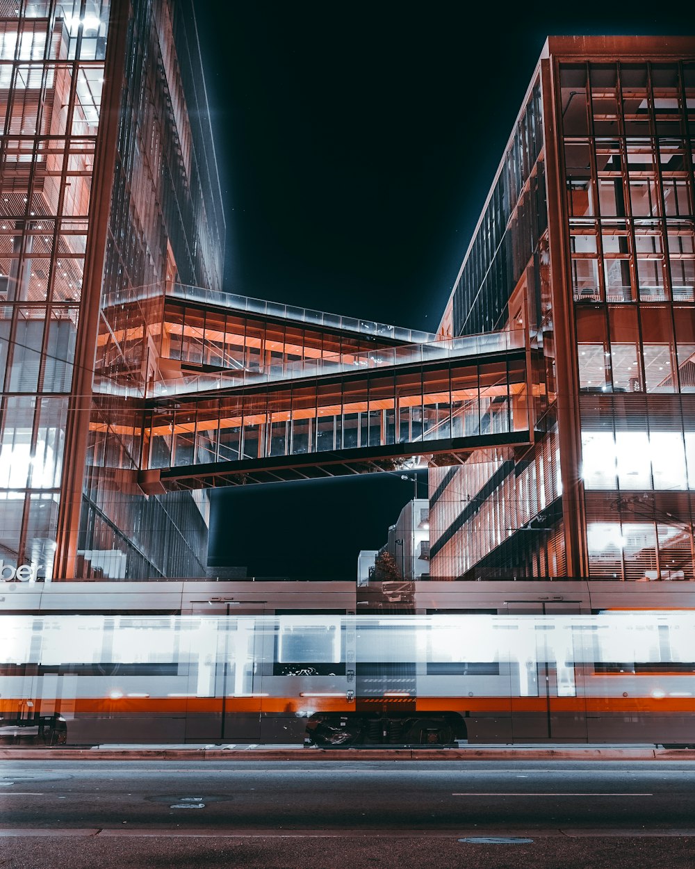 a train passing by a very tall building