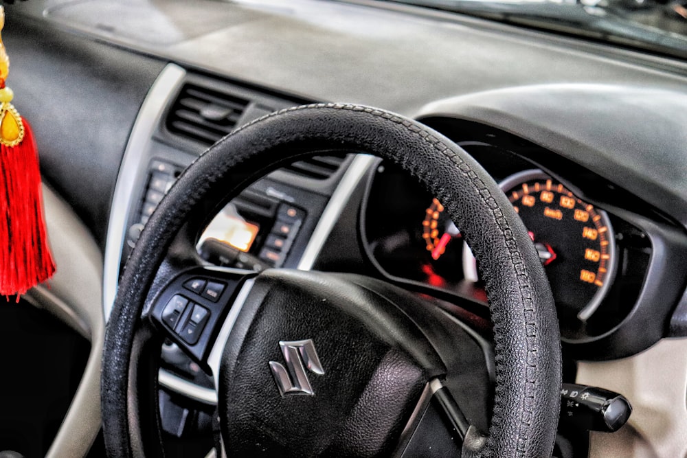 a steering wheel with a tassel hanging from it