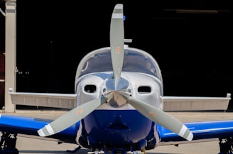 a close up of a propeller plane on a runway