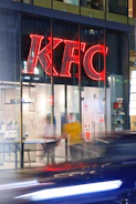 A busy KFC outlet with customers lining up for their favorite meals.